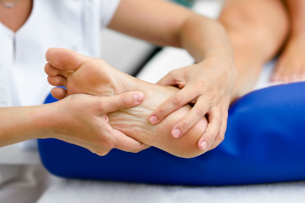 An elderly person receiving treatment from a podiatrist
