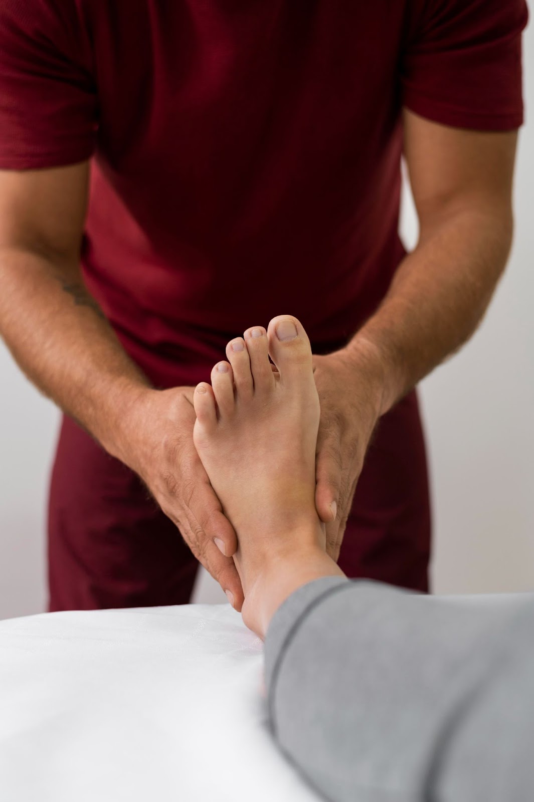 Close-up of a podiatrist delivering mobile podiatry treatment during a home visit