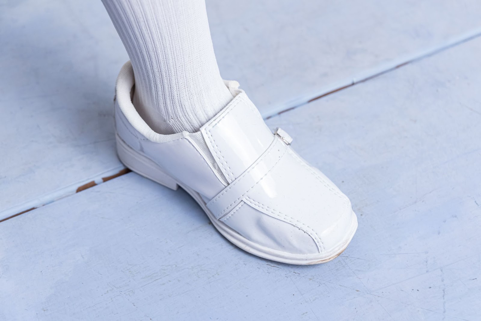Close-up of white velcro walking shoe, a type of specialised footwear often rated as one of the best shoes for elderly for ease of use