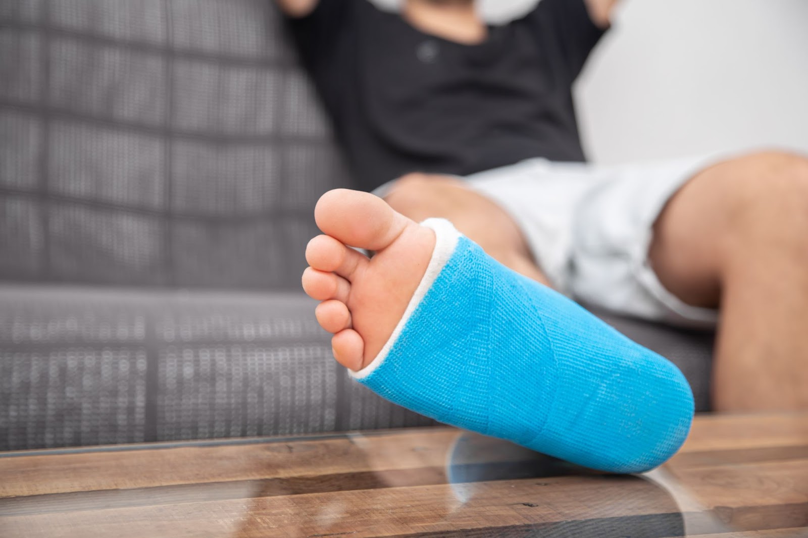 Patient with foot cast receiving diabetes podiatry care for aged care mobility support