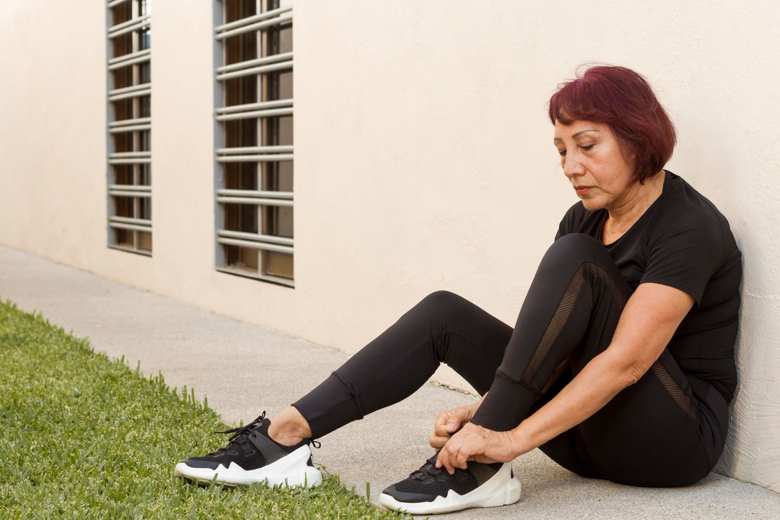 Elderly woman wearing athletic-style specialised footwear, considered among the best shoes for elderly with active lifestyles