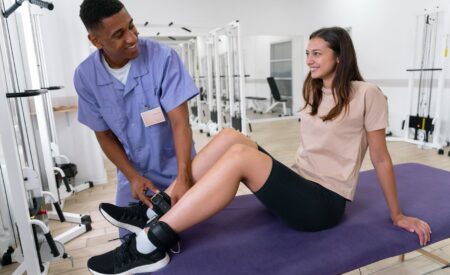 Sports podiatry Australia specialist fitting ankle brace for lower limb injury treatment